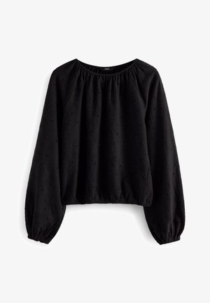 Zwarte blouse met lange mouwen, elastische manchetten en zoom, met een subtiel bloemmotief in ajour en een ronde hals.