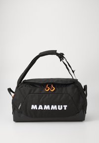 Black duffle bag with orange zipper pulls. Features logo "MAMMUT" in white, padded handle, and fabric texture with a sturdy design.