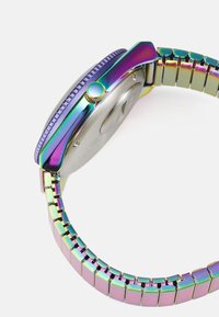 Multicolor stainless steel watch with a polygonal case, rainbow finish, textured bezel, and linked bracelet design, featuring a round crown.