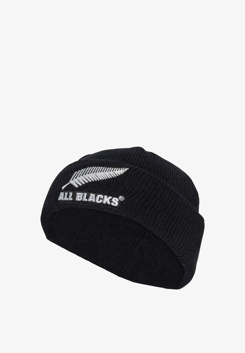 Czarna dziana czapka beanie z prążkowaną strukturą, z haftowanym białym symboliem paproci i logo "ALL BLACKS" z przodu. Prosty, dopasowany fason.