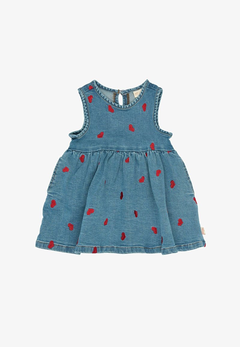 Ujjatlan szabású farmerruházat, világoskék színben, piros szív mintázattal. Összefogott derékrésszel és kulcslyuk záródással rendelkezik.