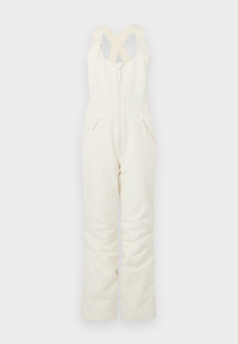 Tuta bianca isolante con bretelle incrociate regolabili, cerniera frontale e due tasche laterali, caratterizzata da una texture liscia e una vestibilità comoda.