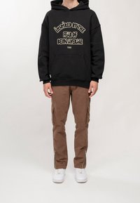 PEQUS Jersey con capucha - black