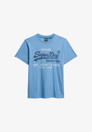 Blauwe katoenen T-shirt met korte mouwen en een vintage afdruk met de tekst "SuperDry" en aanvullende merkdetails. Klassiek ontwerp met ronde hals.