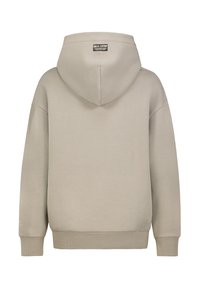 Beige hoodie met een relaxte pasvorm. Voorzien van een zachte textuur, geribde manchetten en zoom, en een label op de achterkant nabij de nek.