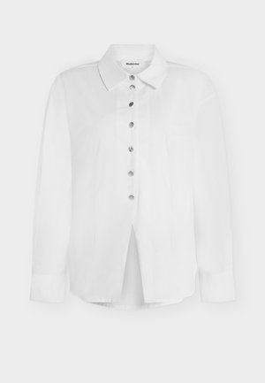 Λευκό πουκάμισο με μακριά μανίκια και κουμπιά στο μπροστινό μέρος, με γιακά και ασημί κουμπιά, ετικέτα Modström μέγεθος S.