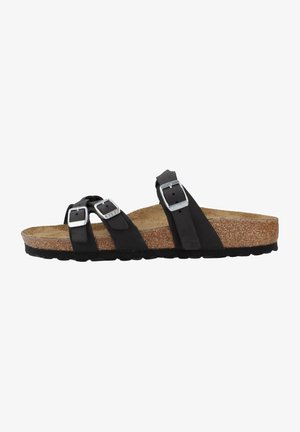 Black cork slide sandal with two adjustable straps, silver rectangular buckles, and a textured footbed for comfort. Rubber outsole.