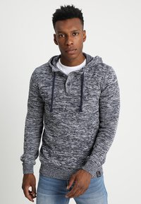 Marineblauwe en grijs gemarmerde hoodie met een kangoeroezak, trekkoordkap, knopenlijst en ribgebreide manchetten en zoom. Zachte gebreide textuur.