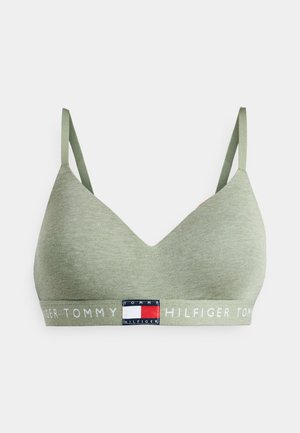 Soft green cotton bralette with a V-neck, thin adjustable straps, and a branded elastic band featuring red, white, and blue accents.