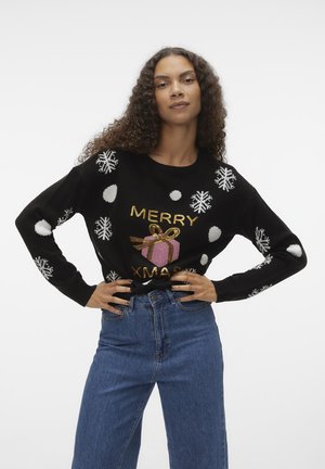 Pulover tricotat negru, cu fulgi de zăpadă și buline albe, având textul auriu "MERRY XMAS" și un grafic cu un cadou roz în centru.