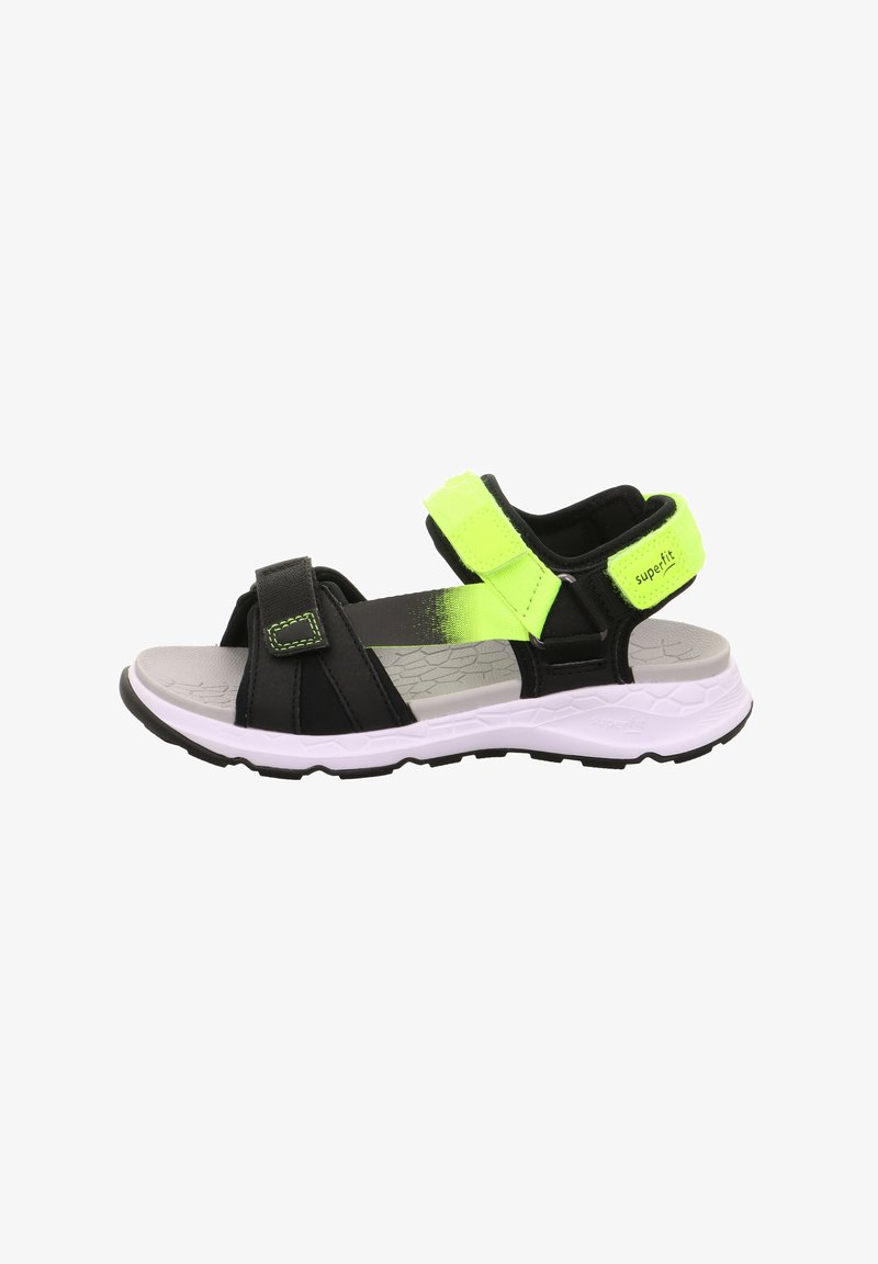 Sandales de sport avec une base noire, des sangles vert fluo, des fermetures à velcro ajustables et un semelle intérieure texturée grise. Semelle en caoutchouc blanche et striée.