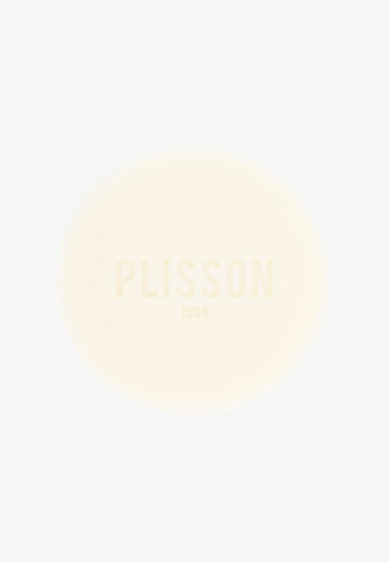 Round, cream-colored shaving soap with embossed text "PLISSON 1808" in a subtle, light hue, featuring a smooth, glossy surface.