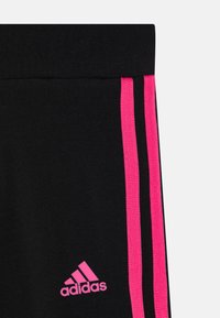 adidas Performance JUNIOR - Leggings - black/pulse magenta