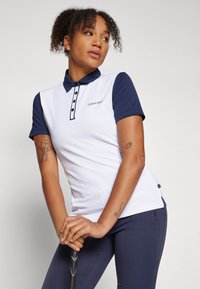 Πολύχρωμο πουκάμισο polo Calvin Klein σε λευκό και ναυτικό, με γιακά, κουμπιά και κοντά μανίκια, και με λογότυπο στο στήθος.