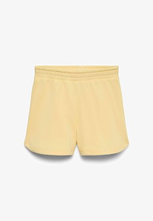 Soft yellow elastic waist shorts with a smooth texture and slightly curved hem, displayed on a white background.