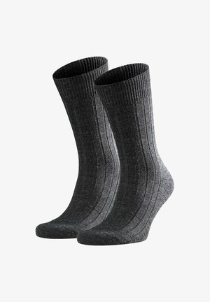 Calzini grigi a coste con tessuto texturizzato, dotati di polsino elastico nella parte superiore e punta rinforzata per una maggiore durata.