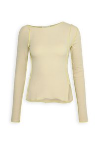 Pitkähiha beige paita, jossa on keltaisia ompeluaksentteja, hieman rento istuvuus ja pyöreä kaula-aukko, valmistettu ribbikankaasta.