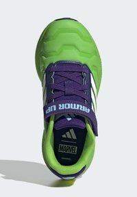 Purple and green athletic shoe with a textured upper, hexagonal design, and Velcro strap. Features "Marvel" branding and white accents.