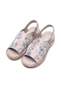 Slingback sandals with open toes, featuring perforated multicolor floral patterns and cushioned insoles on light beige soles.