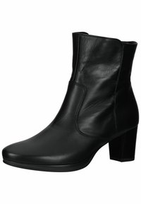 Bottine en cuir noir avec une finition lisse, bout pointu et talon carré. Présente des coutures latérales et une silhouette élégante.