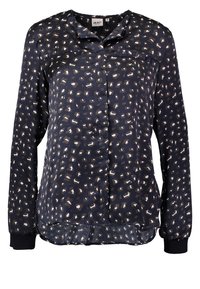 Blusa marina con stampa leopardata in beige e bianco. Maniche lunghe con polsini elasticizzati, chiusura con bottoni e un finish leggermente trasparente.