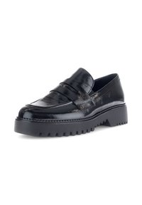 Black patent leather loafers with a chunky sole, featuring a classic strap detail and textured finish. Thick, treaded rubber outsole.