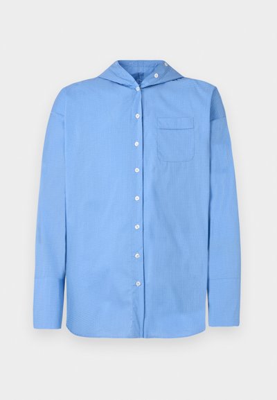 Sinine pikakä sleeves särg, millel on ruuduline muster, nööpide esikülg, terav krae ja üks rinna tasku. Valmistatud kergest kangast.