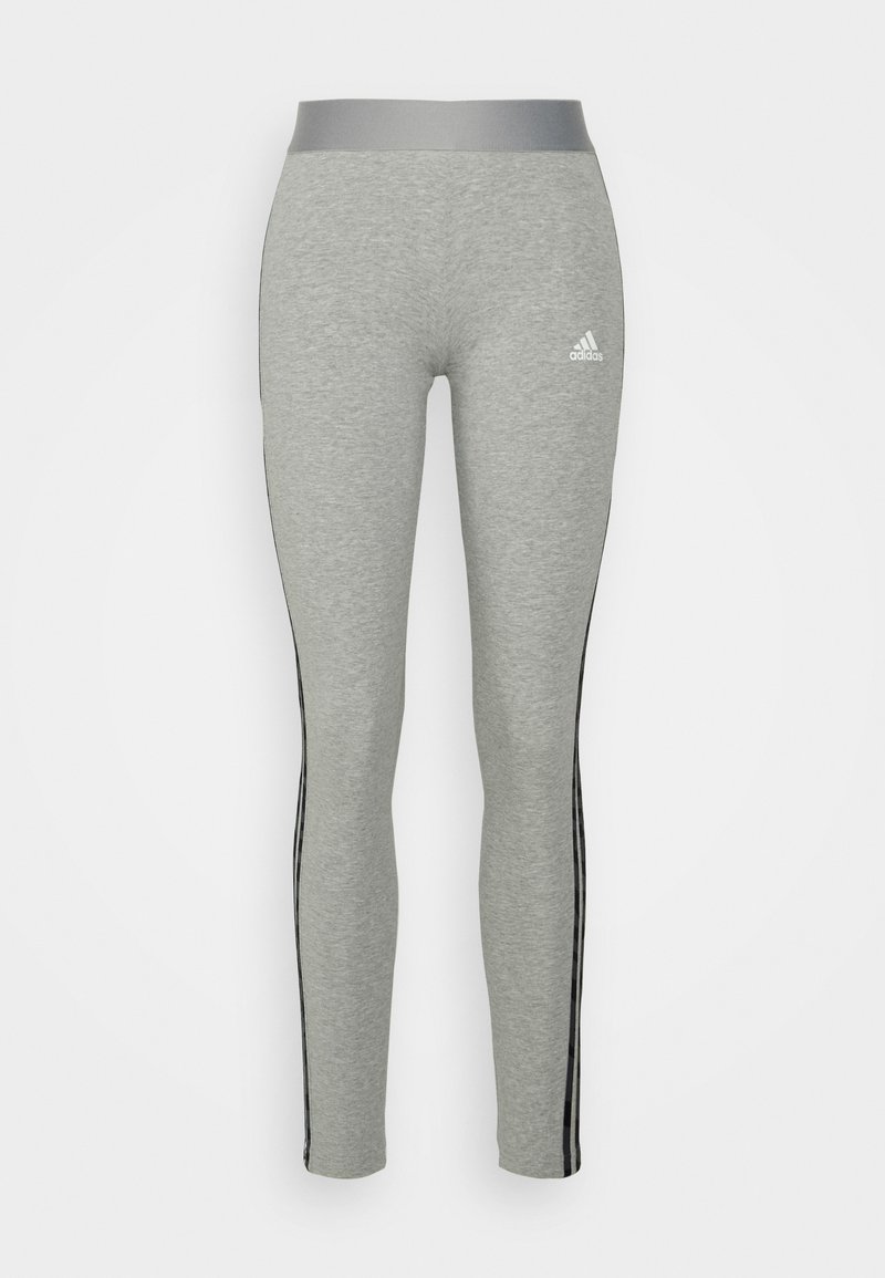 Leggings cinzentos com uma textura suave, apresentando uma cintura elástica larga e riscas laterais pretas. Pequeno logótipo branco na parte frontal.