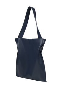Navy blue leather tote bag with a smooth texture, featuring a slouchy design and a single long strap for carrying.