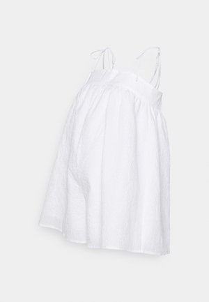 Vestido branco sem mangas com alças finas, apresentando um tecido texturizado e uma silhueta larga e esvoaçante. Detalhado com uma cintura franzida.