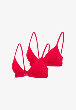 Czerwone sportowe biustonosze w kształcie trójkąta z cienkimi regulowanymi ramiączkami i subtelnymi teksturowanymi wzorami, z małym białym logo na elastycznej taśmie.