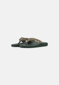 Green flip-flops with a textured footbed and two-tone straps. Straps are olive green with a matte finish; sole is dark green.