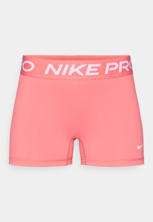 Pantalones cortos Nike Pro en un vibrante color rosa. Hechos de material liso y elástico. Cuentan con una cinturilla ancha con el logo "NIKE PRO" y el icónico Swoosh.