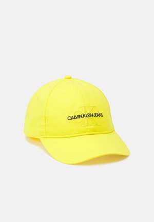 Casquette de baseball jaune vif avec "Calvin Klein Jeans" et logo CK discret brodé à l'avant.
