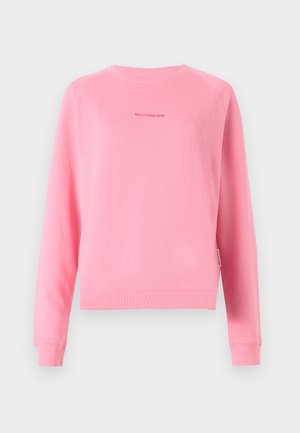 Pink sweatshirt with long raglan sleeves, ribbed cuffs and hem, featuring a small printed logo at the center. Smooth, cotton fabric texture.