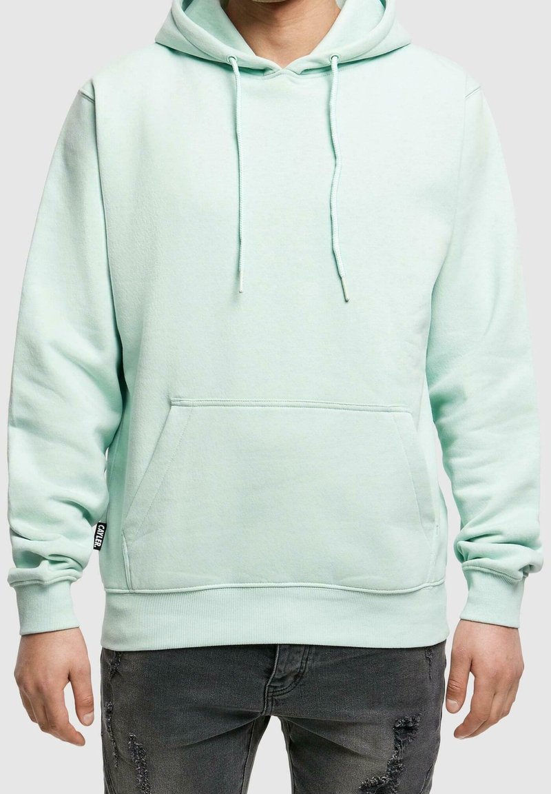 Felpa con cappuccio verde menta, dotata di tasca frontale, lacci e polsini a coste. Realizzata in tessuto morbido, presenta una vestibilità rilassata e dettagli minimali.
