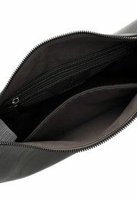 Black leather bag with open zipper showing empty main compartment and internal zippered pocket inside.