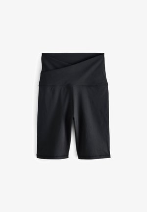 Čierne cyklistické šortky vyrobené z pružného materiálu. Pás má prekrížený dizajn, hladké švy a priliehavý strih.