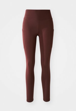 Bordeaux leggings met een hoge tailleband, een aansluitende pasvorm, zachte textuur en zijzakken voor extra gemak. Glad, rekbaar materiaal.