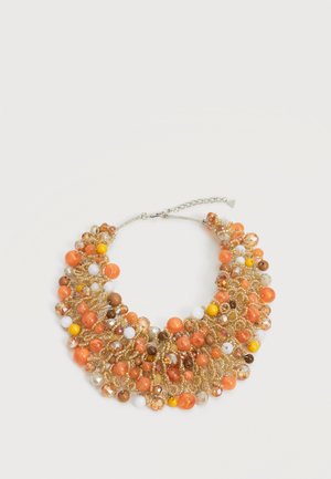 Kaelakee, millel on spetsiaalsete klastrite kujul oranžide, kollaste, valgete, pruunide ja kuldsete helmeste kombinatsioon punutud kuldse tooniga traadist.