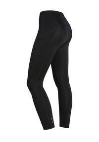 Leggings neri realizzati in tessuto elastico, con vita alta, tasche laterali e dettagli cucitura sui pantaloni.