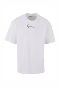 White cotton t-shirt featuring a black signature-style logo on the left chest area. Short sleeves and a relaxed fit design.