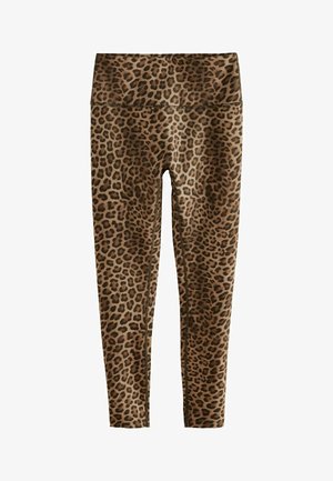Leggings in stampa leopardata con vita alta, realizzati in tessuto morbido, con una miscela di macchie marroni e nere su uno sfondo beige.