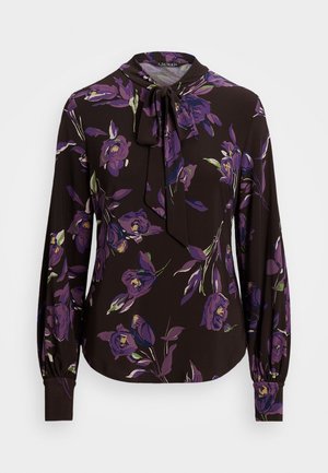 Blouse noire à manches longues avec imprimé floral violet, poignets froncés et détail nœud à nouer à l'avant.