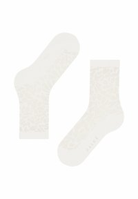 Kniestrümpfe in hellbeige mit einem texturierten, abstrakten Muster. Weiches Material mit verstärkter Zehen- und Fersenpartie. Markenlogo an der Seite aufgedruckt.