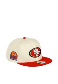 Cream-colored baseball cap with a red visor, featuring an embroidered black and red "SF" logo and a colorful "Pro Bowl Hawaii" patch on the side.