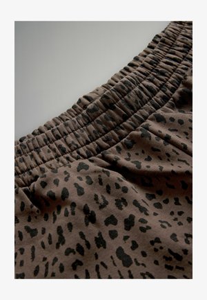 Brunt stof med sort leopardprintmønster, med en elastisk talje, der er rynket, hvilket skaber et tekstureret og fleksibelt design.