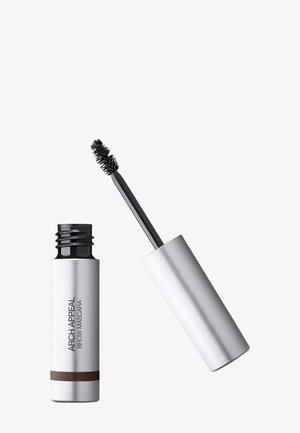Tube argenté de mascara pour sourcils Arch Appeal avec le capuchon retiré et la brosse applicatrice enduite de produit foncé.