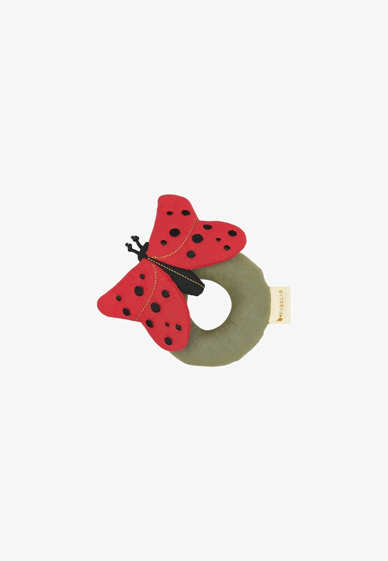 Rotes, schmetterlingsförmiges Spielzeug mit schwarzen Punkten auf den Flügeln, montiert auf einem grünen, runden Sockel. Weiches Material aus Stoff mit strukturiertem Finish.