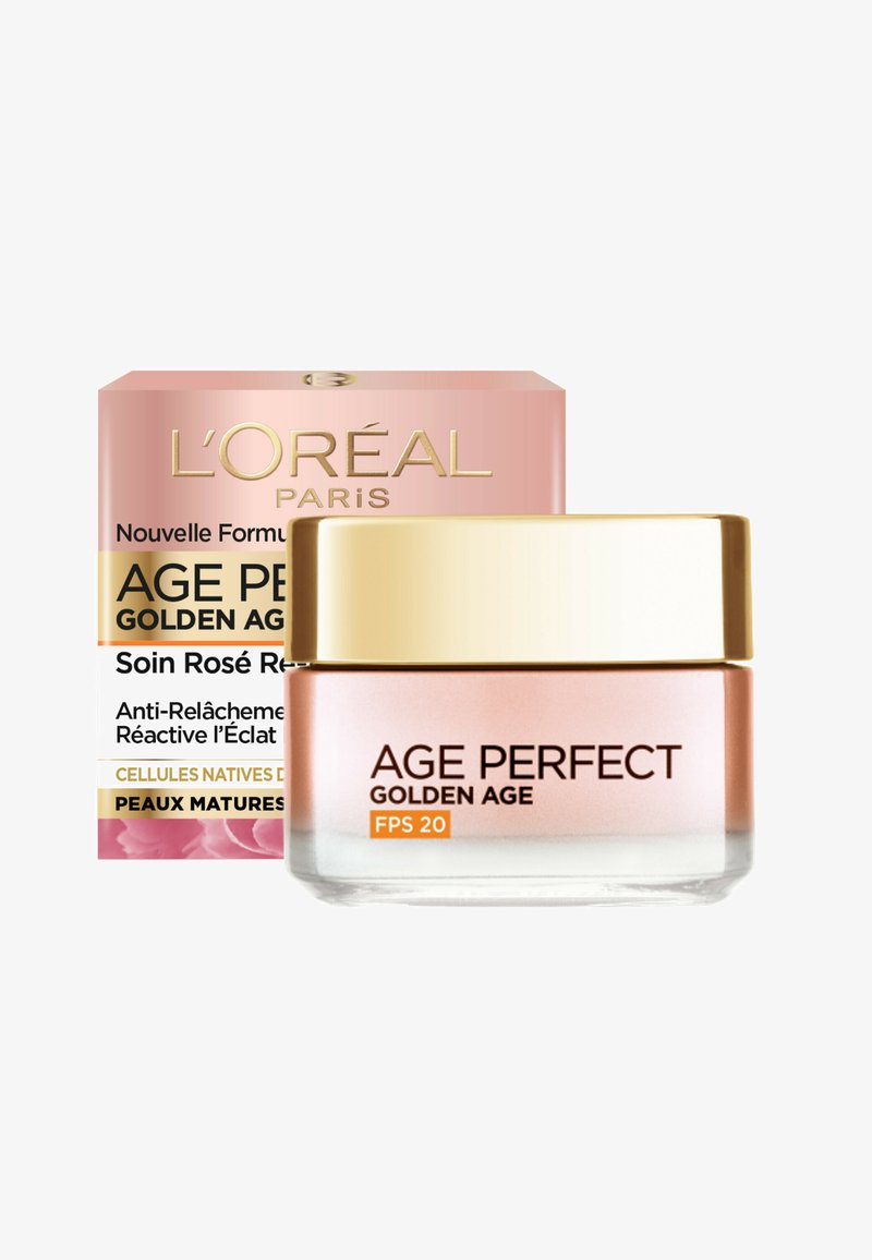 Crème L'Oréal Age Perfect Golden Age dans un pot en verre transparent avec un couvercle doré, accompagnée d'une boîte rose ornée de texte doré et d'accents floraux.